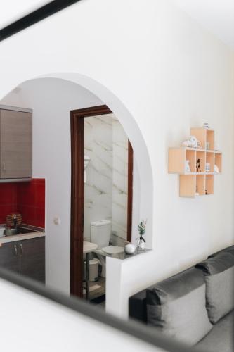 a view of a kitchen through a mirror at 3 Venti - Ostria in Liapades