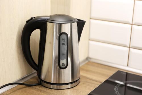 a black and silver tea kettle sitting on a counter at Casa Luxury Wellness Apartman By BLTN in Siófok