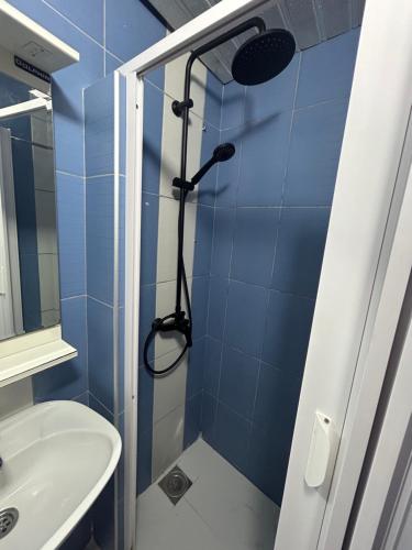a bathroom with a shower and a sink at Resort Stikovic in Dobra Voda