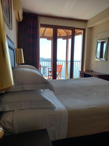 Postel nebo postele na pokoji v ubytování Poseidon villa m ammos