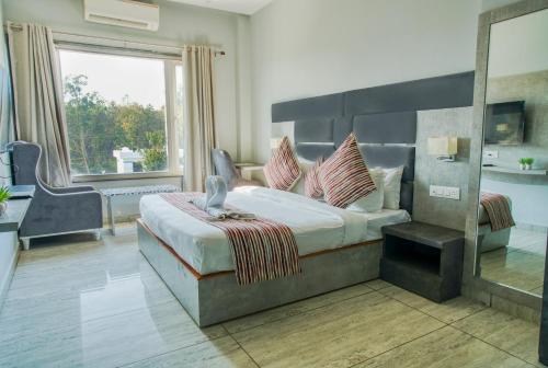 Postel nebo postele na pokoji v ubytování Hotel Vasdaa Grand