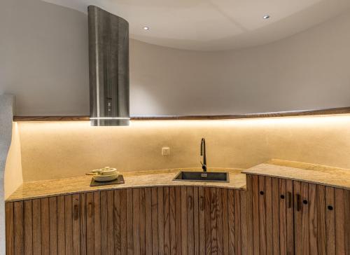 a kitchen with a sink and a counter at Saha Casa Boutique Hotel Da Nang in Da Nang