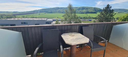 a table and chairs on a balcony with a view at Motorest Starý Jičín in Starý Jičín