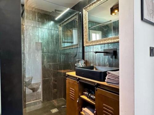 a bathroom with a sink and a glass shower at Seaview Dreams Luxury 2 bedroom apartment with amazing views and balcony BY NAMASTE ELITE in Torremolinos