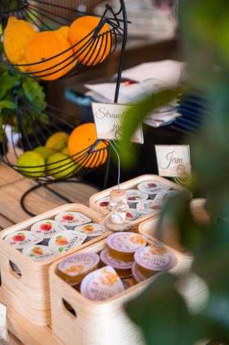 a display of cupcakes and oranges on a table at Hotel Marina in Fažana