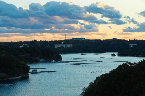 a view of a river with boats in the water at Villa Ryusei in Ugata