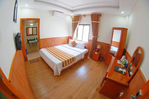 Postel nebo postele na pokoji v ubytování Kieu Anh Hotel Vung Tau