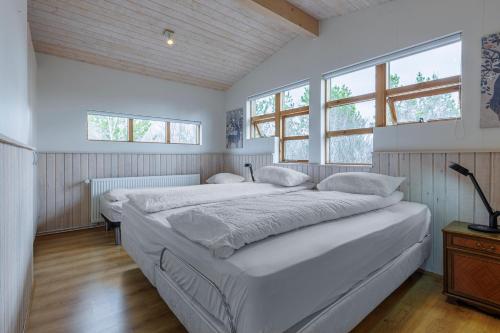 Postel nebo postele na pokoji v ubytování Cabin Úthlíð - Birta Rentals