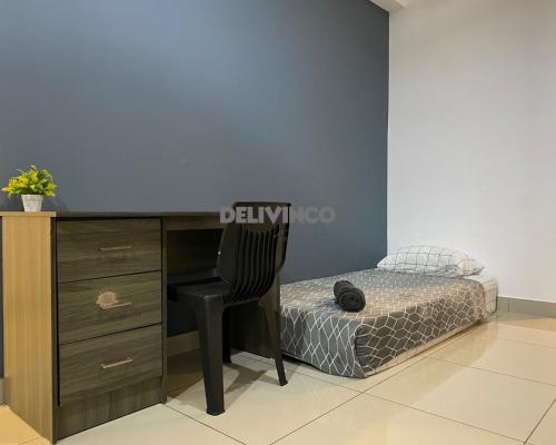 a bedroom with a desk and a chair next to a bed at Comfy 2 bedroom for 6 pax, 3mins walk to Kamalinda in Shah Alam