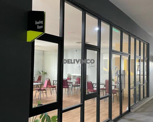 a view of a dining room through a glass door at Comfy 2 bedroom for 6 pax, 3mins walk to Kamalinda in Shah Alam