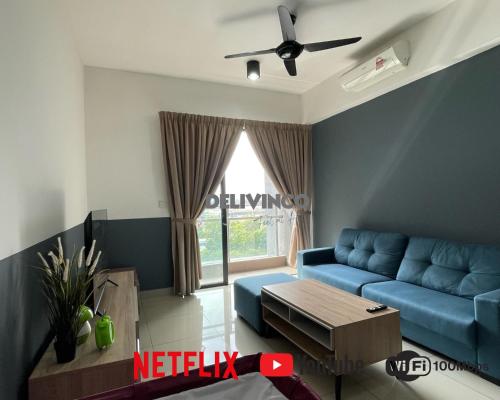 a living room with a blue couch and a window at Comfy 2 bedroom for 6 pax, 3mins walk to Kamalinda in Shah Alam