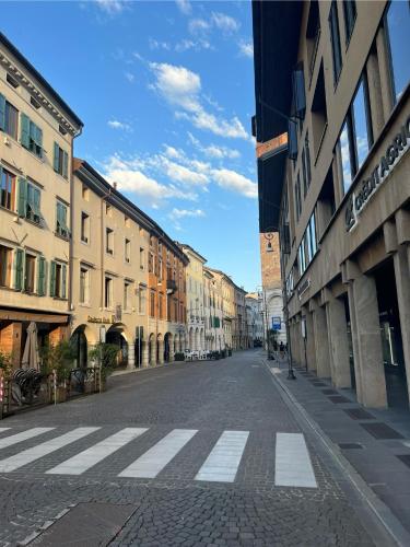 an empty street in a city with buildings at Interno 23 Duomo Apartment in Udine
