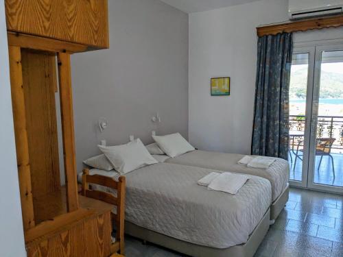 A bed or beds in a room at Kamelia