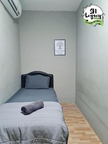 Postel nebo postele na pokoji v ubytování Hotel SN Legacy