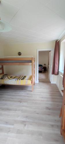 a room with two bunk beds and a hallway at Ô2J in Fresse