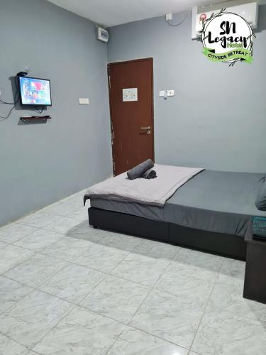Postel nebo postele na pokoji v ubytování Hotel SN Legacy