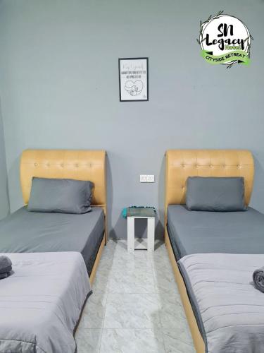 Postel nebo postele na pokoji v ubytování Hotel SN Legacy