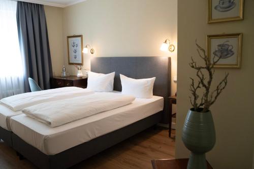 Cama o camas de una habitación en Hotel Altmünchen by Blattl