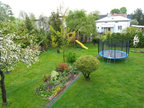 an aerial view of a backyard with a trampoline at Viktorijas dārzs in Liepāja