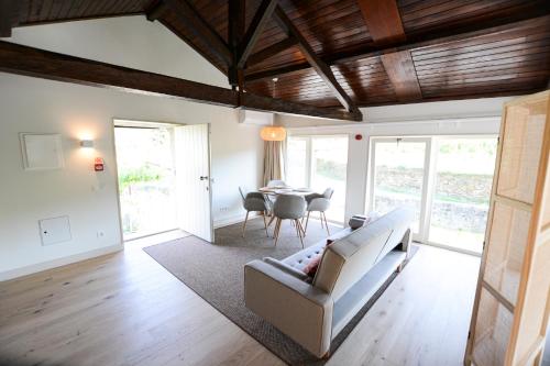 a living room with a couch and a table at Quinta do Fundo in Mondim de Basto