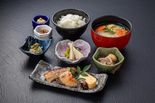 a group of bowls of food on a table at Nara Washington Hotel Plaza in Nara