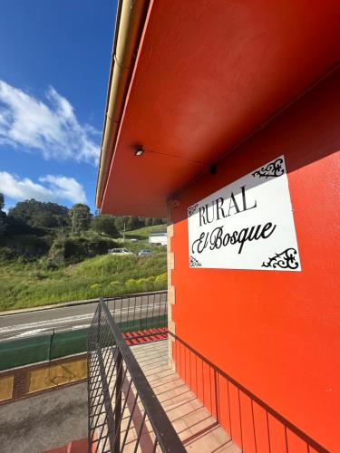 a sign on the side of a building at Rural El Bosque in Entrambasaguas