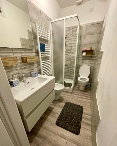 a bathroom with a sink and a toilet at Brezza Marina in Diano Marina