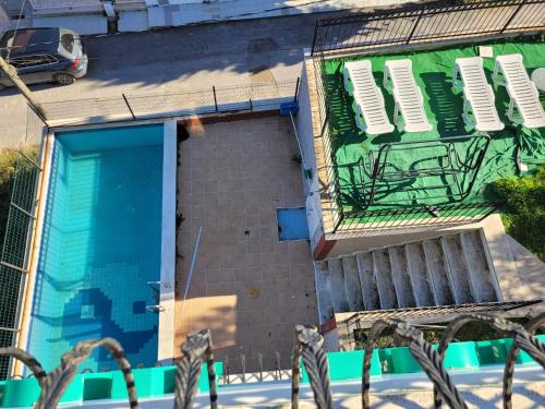an overhead view of a building with a swimming pool at Terrace Urla in Urla