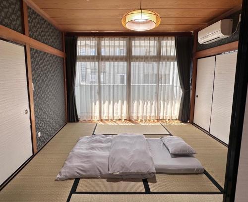 Giường trong phòng chung tại Maria Hotel 宇都宮