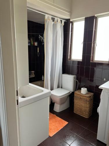 a bathroom with a toilet and a sink at Villa Cathrine in Kanali
