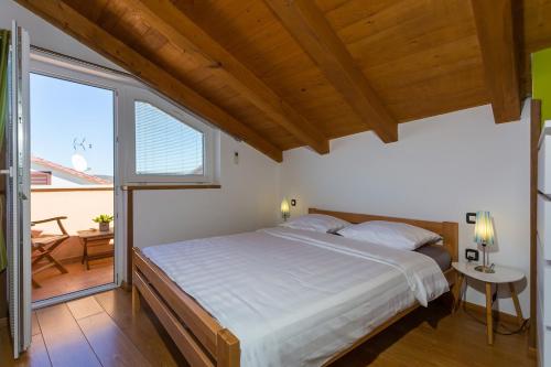 Posteľ alebo postele v izbe v ubytovaní Stone House Ana Funtana