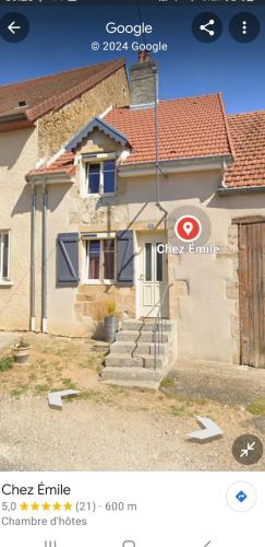 a picture of a house with a sign in front of it at Chez Émile maison d'hotes 2 chambres avec jardin privé in Humes