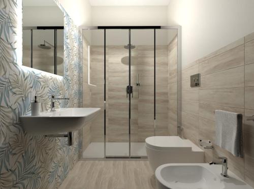 a bathroom with a shower and a toilet and a sink at Un Posto Al Sole in San Vito lo Capo