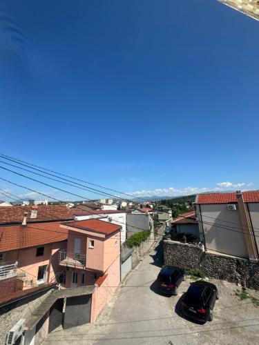 a view of two cars parked on a street at Hostel Lejla in Podgorica