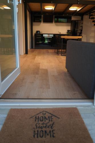 a welcome mat with the words home sweet home on the floor at Loft Neunkirchen in Neunkirchen am Brand