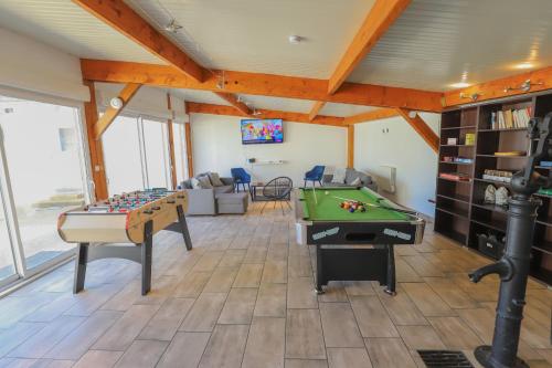 a living room with a pool table and ping pong ball at Crazy Villa Luigny 28 - Heated pool - City Stade - 1h20 Paris - 30P in Luigny