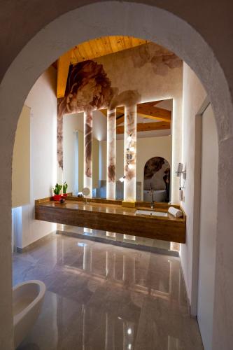 a bathroom with two sinks and a large mirror at La Divina - free parking - in Tropea