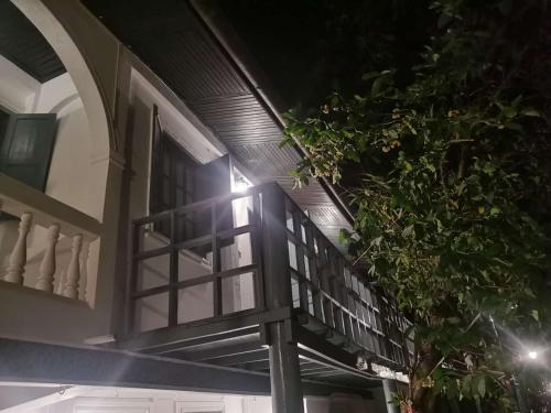 a window on the side of a building at Chair Riverside in Luang Prabang