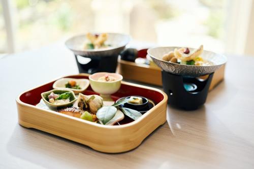 a tray of food sitting on top of a table at Tsubakikan in Aomori