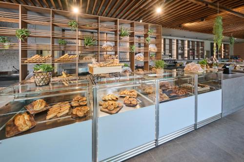 a bakery with a bunch of pastries on display at Aminess Style Camping Avalona Resort - Pitches in Povljana