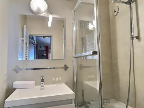 a bathroom with a sink and a shower at Appartement Val-d'Isère, 4 pièces, 6 personnes - FR-1-411-682 in Val-d'Isère