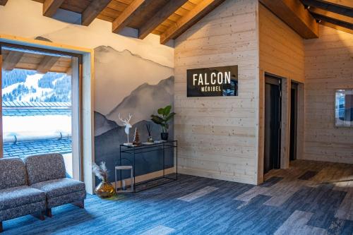 a lobby with a sign that reads falcon agent at Falcon Lodge by Alpine Residences in Méribel