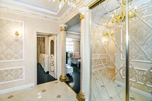 a hallway of a home with a chandelier at Park Azure Deluxe Apartment By Baku Housing in Baku