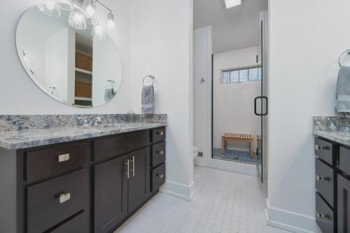 a bathroom with a sink and a mirror at Blueberry Beach House indoor pool, hot tub in South Haven