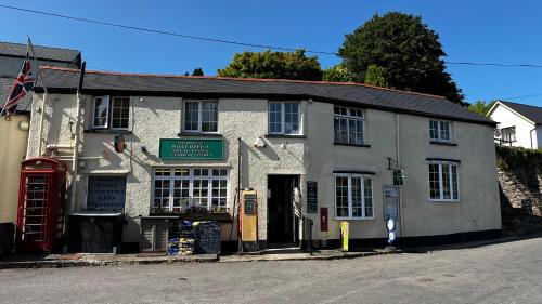 a building on the corner of a street at Exmoor BnB in Withypool on Two Moors Way in Withypool