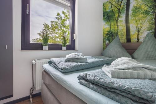 Postel nebo postele na pokoji v ubytování Kajüte am Steinhuder Meer