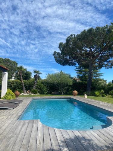 a small swimming pool on a wooden deck at Villa 55 in Grimaud