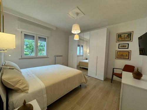 a bedroom with a large bed and a room with a bed sqor at Donna Antonietta in Sant'Agnello
