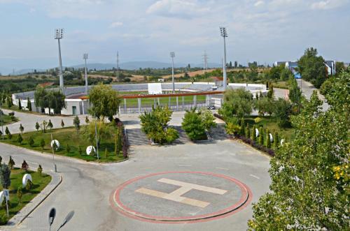 an empty parking lot with an x on it at Arena Grand Hotel in Quba