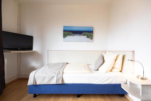 Postel nebo postele na pokoji v ubytování acora Bremen Garden Living the City